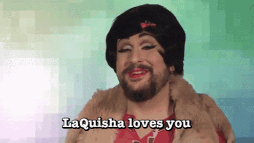 a man with a beard is wearing a fur coat and a wig and says laquisha loves you .