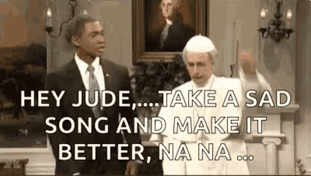 a man in a suit and tie is talking to a man in a pope costume .