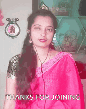 a woman in a pink saree is wearing headphones and says thanks for joining