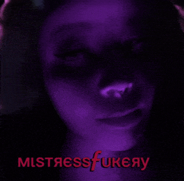 a close up of a woman 's face with the words mistressfukeay written in pink