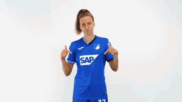 a woman in a blue shirt that says sap on it