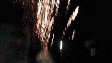 a bunch of fireworks are going off in the dark
