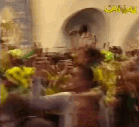 a blurry picture of a crowd of people with the word canal in yellow