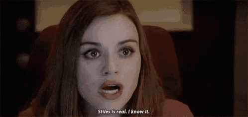 a close up of a woman 's face with the words `` stiles is real , i know it '' written on it .