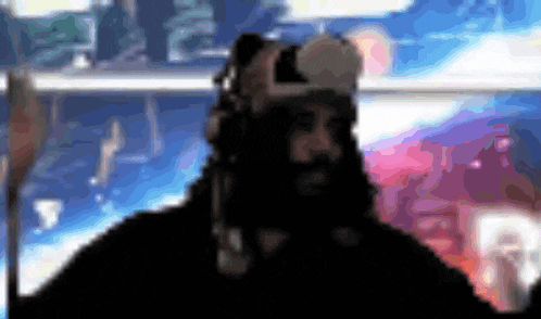 a blurry picture of a man wearing headphones and a virtual reality headset