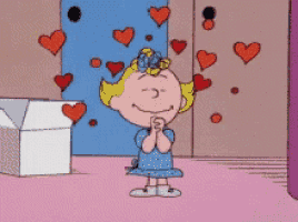 a girl in a blue dress is surrounded by red hearts
