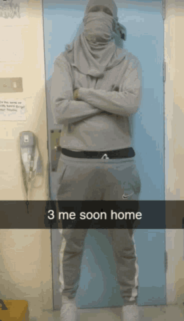 a man standing in front of a door with his arms crossed and the words 3 me soon home on the bottom