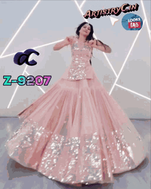 a woman in a long pink dress is dancing in front of a sign that says artistry cin