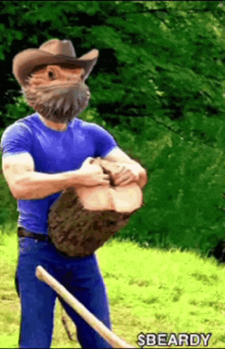 a man with a beard wearing a cowboy hat is holding a large log in his hands