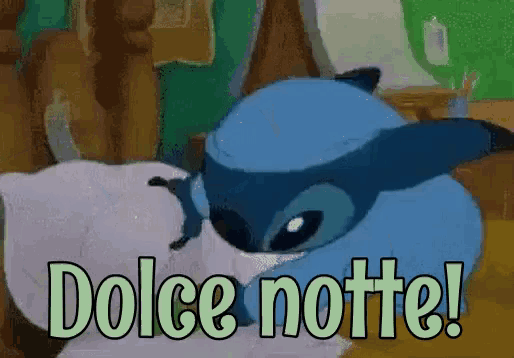 a cartoon character laying on a bed with the words " dolce notte " written below it
