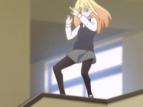 a girl with blonde hair is standing on a ledge