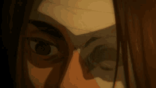 a close up of a person 's face with a bandaged eye