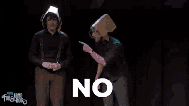 two men standing on a stage with the word no in front of them