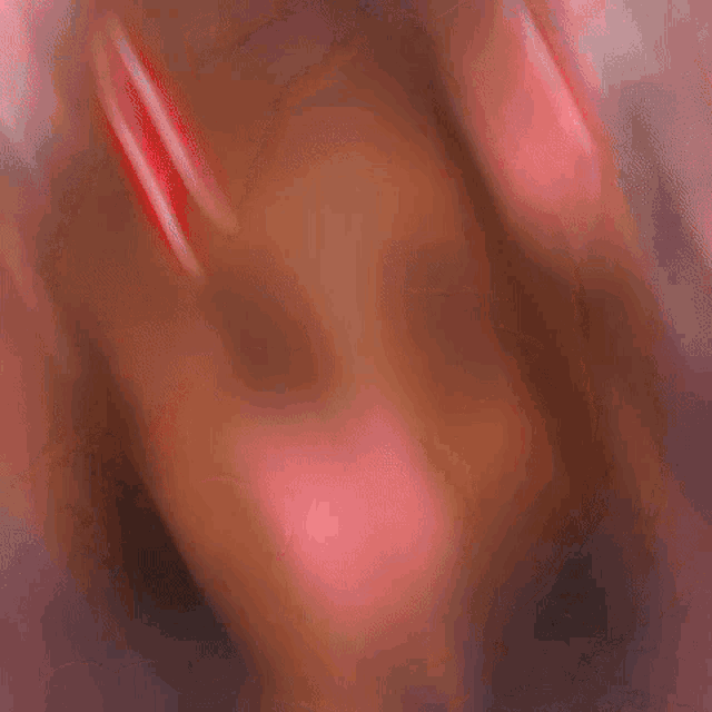 a girl with devil horns on her head and a heart on her face