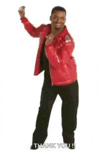 a man in a red jacket is dancing and says `` happy dancing ! ''