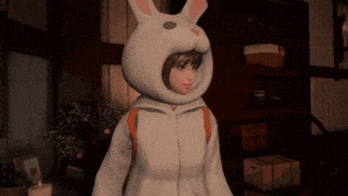 a girl in a white bunny costume is standing in a room