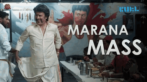 a man in a white shirt stands in front of a mural that says ' marana mass ' on it