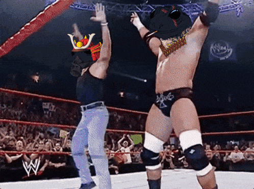 a man in a gas mask stands next to a wrestler in a ring