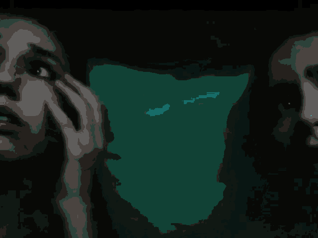 a close up of a person 's hand against a dark background