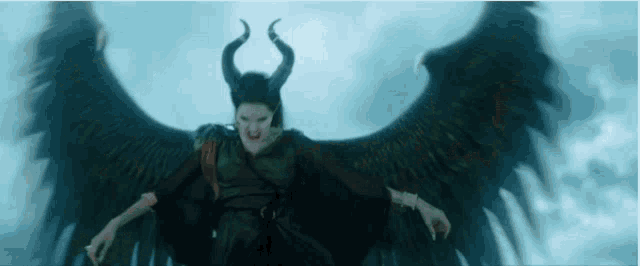 a woman with horns and wings is wearing a mask and flying through the air .