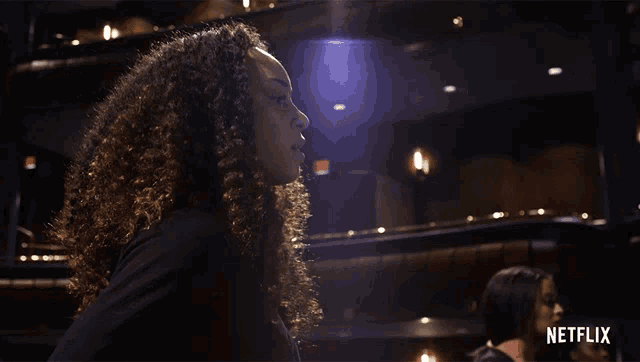 a netflix ad shows a woman in a theater