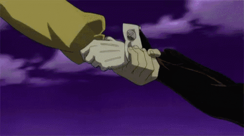 a man in a suit is shaking hands with another man in a white glove .