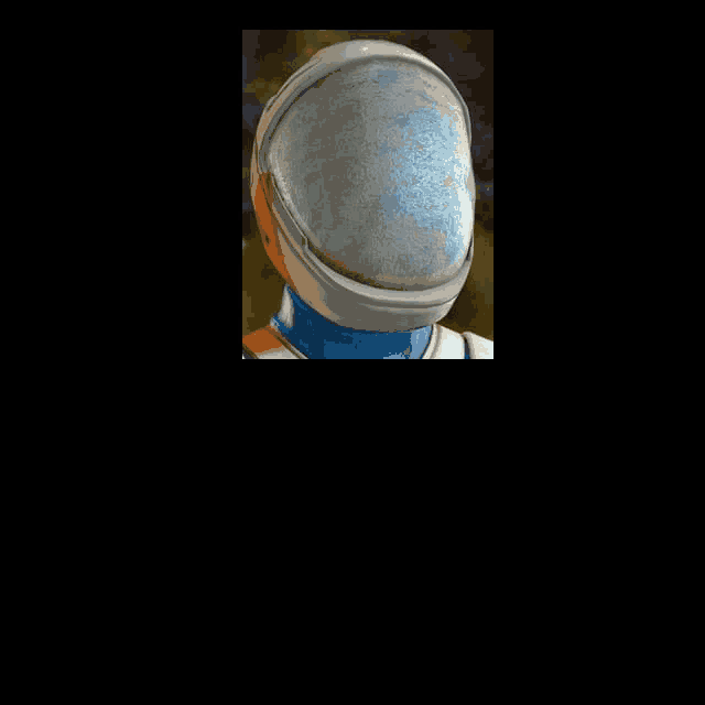 a close up of a person 's head with a helmet on .