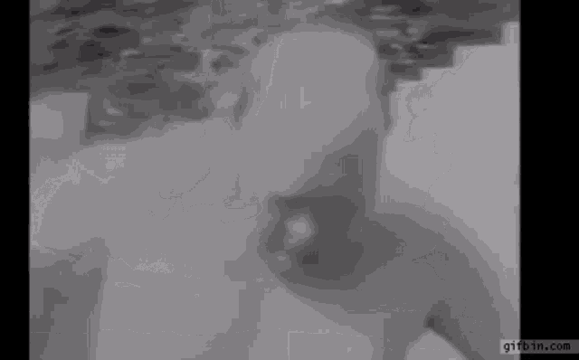 a man is swimming in a pool with his head in the water .
