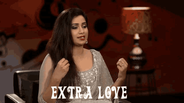 a woman sitting in a chair with the words extra love written on the bottom