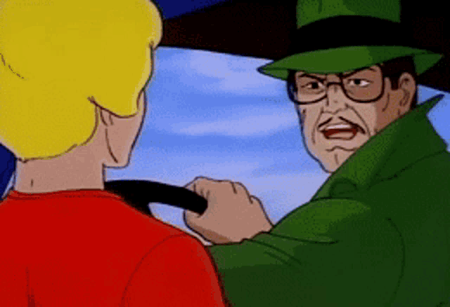 a man in a green hat is talking to a man in a red shirt