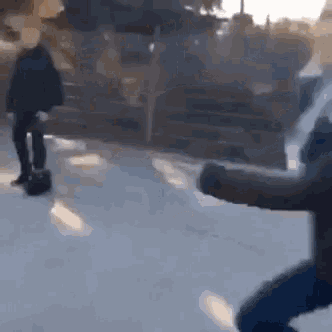 a man is standing in the snow holding a briefcase while another man stands behind him .