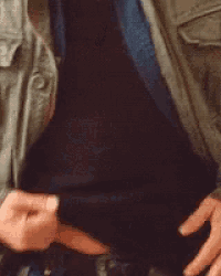 a close up of a person 's hand on their pants .