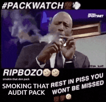 a man in a suit and tie is smoking a cigarette .