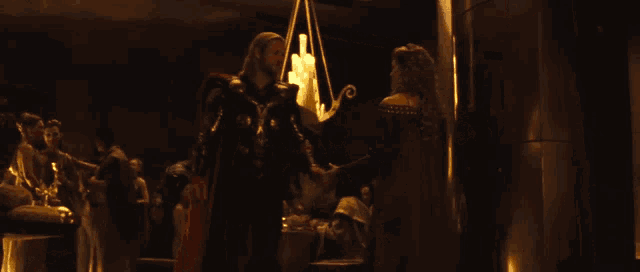 a man and a woman are standing next to each other