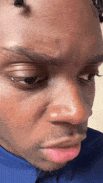 a close up of a man 's face with his mouth open
