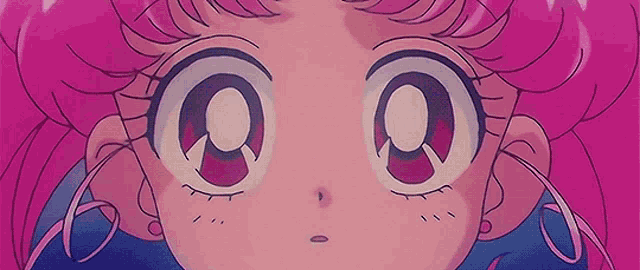 a close up of a cartoon girl 's face with pink hair and big eyes .