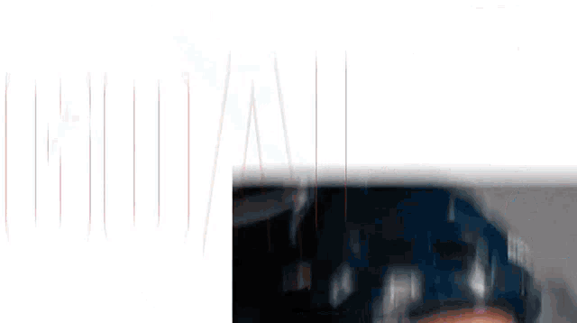 a blurry picture of a person 's face with a white background and red lines
