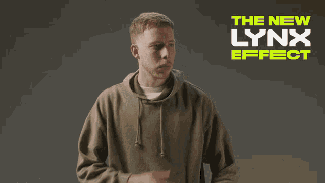 a man in a green hoodie is standing in front of a sign that says the new lynx effect