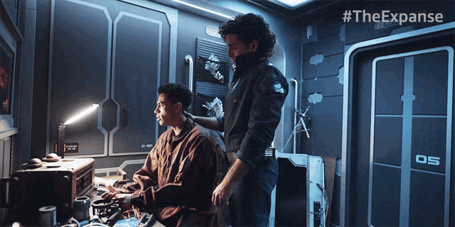 two men in a room with the hashtag #theexpanse
