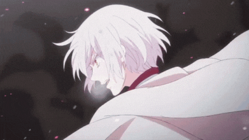 a close up of a person with white hair and red eyes