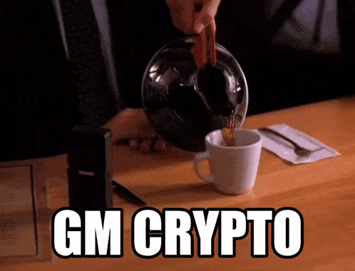 a person pouring coffee into a cup with the words gm crypto on the bottom