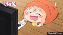 a cartoon character is eating chips while laying on the floor in front of a television