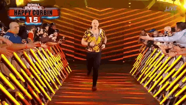 a man is walking through a tunnel with a sign that says `` happy corbin '' .