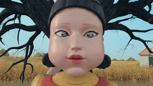 a close up of a doll 's face with a house in the background