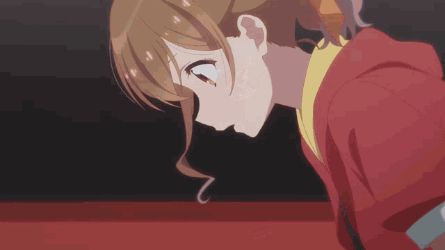 a close up of a girl in a red jacket
