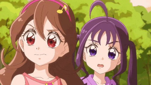 two anime girls are standing next to each other and one has a pink headband with a note on it