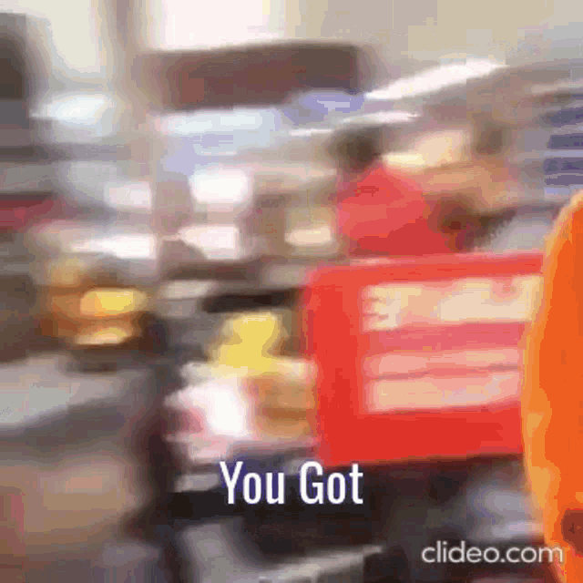 a blurry picture of a person carrying a box that says you got .