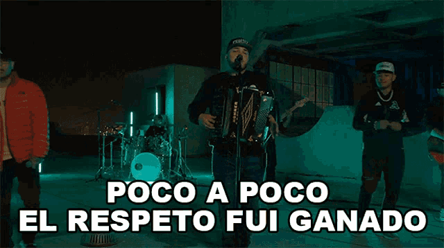 a man singing into a microphone while playing an accordion with the words poco a poco el respecto fui ganado below him