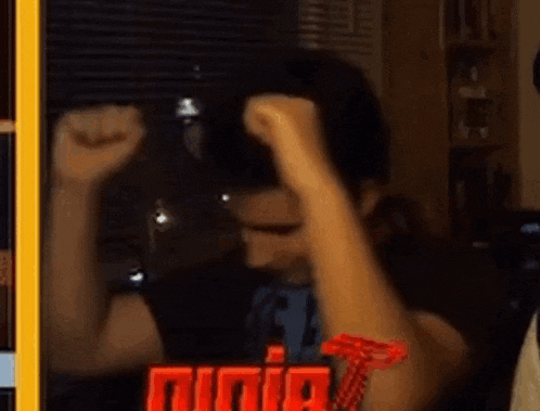 a man wearing a shirt that says ninja