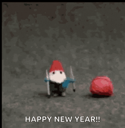 a gnome with a red hat is laying on the ground with the words happy new year below him